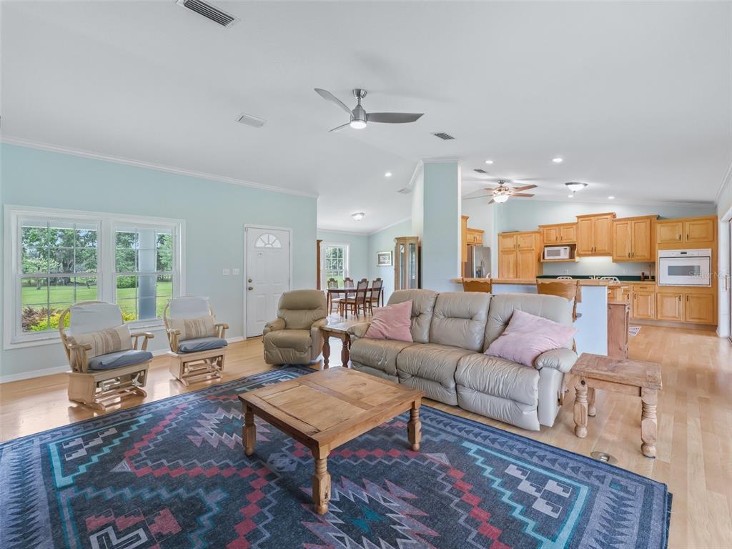 1500 Northwest 155th Street Citra, FL 32113 - Photo 11 of 43 a living room with furniture and a table