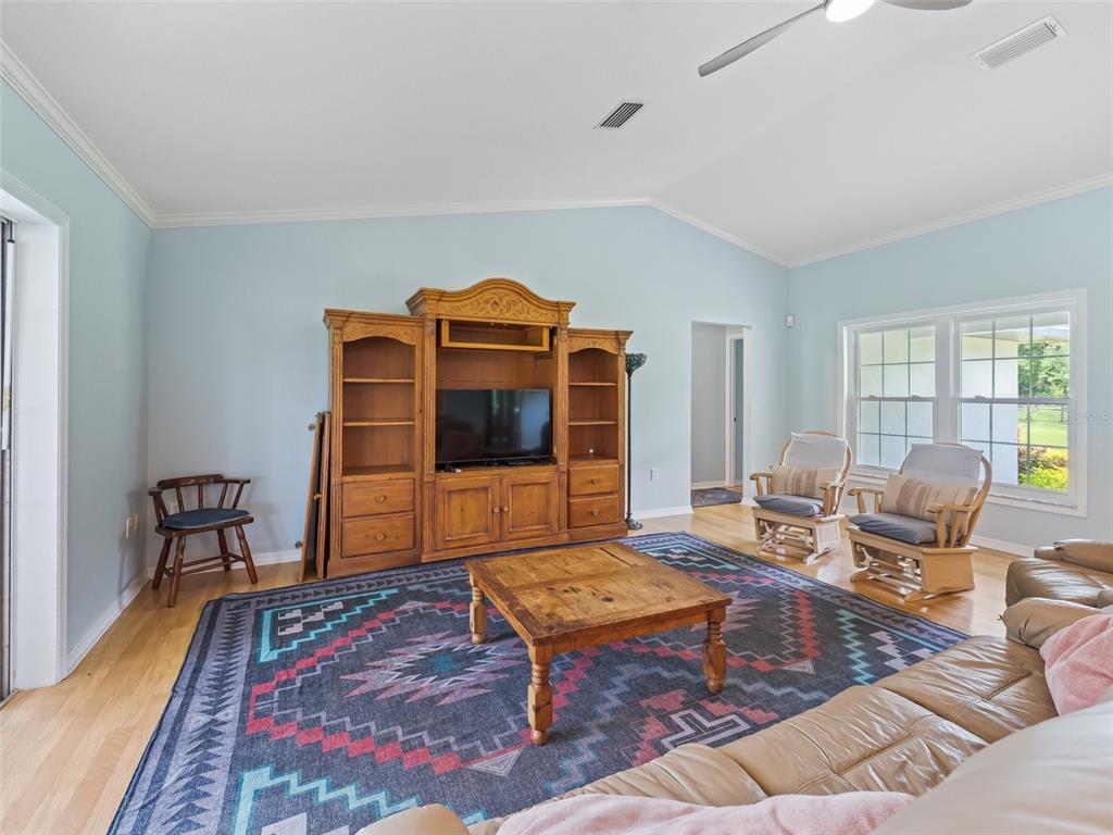 1500 Northwest 155th Street Citra, FL 32113 - Photo 13 of 43 a living room with furniture a rug and a table