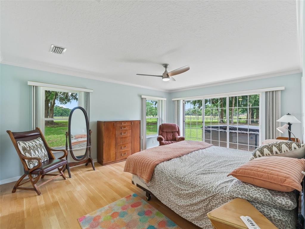 1500 Northwest 155th Street Citra, FL 32113 - Photo 14 of 43 a bedroom with a bed and a large window