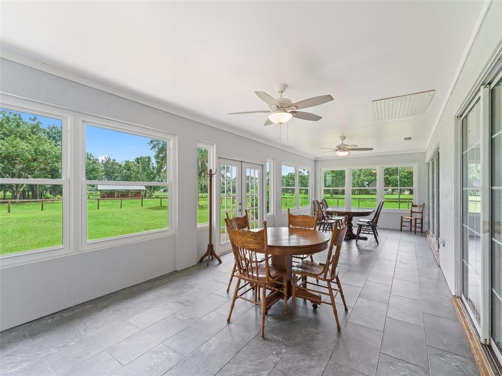 1500 Northwest 155th Street Citra, FL 32113 - Photo 26 of 43 a view of a dining room with furniture window and outside view