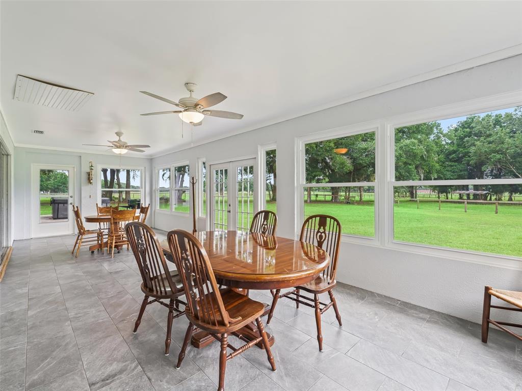 1500 Northwest 155th Street Citra, FL 32113 - Photo 28 of 43 a dining room with furniture garden view and a floor to ceiling window