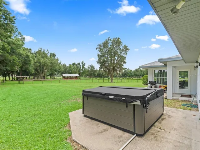 a view of a house with a big yard