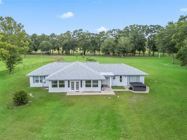 a aerial view of a house with a big yard