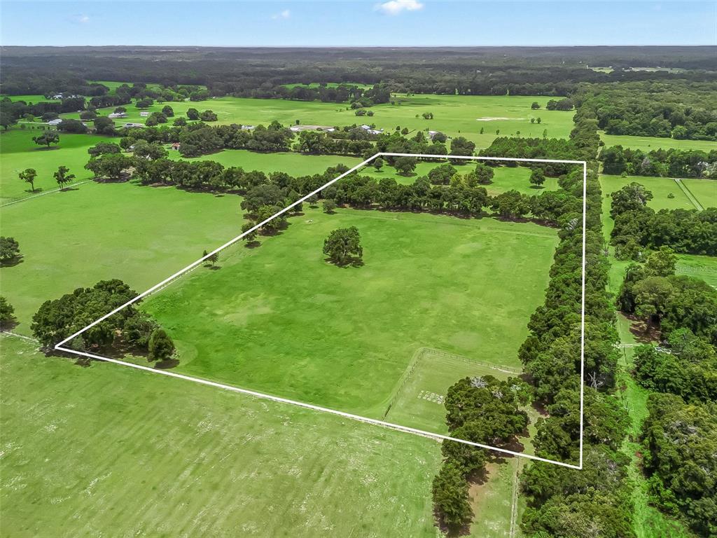 1500 Northwest 155th Street Citra, FL 32113 - Photo 3 of 43 a view of a field with a big yard