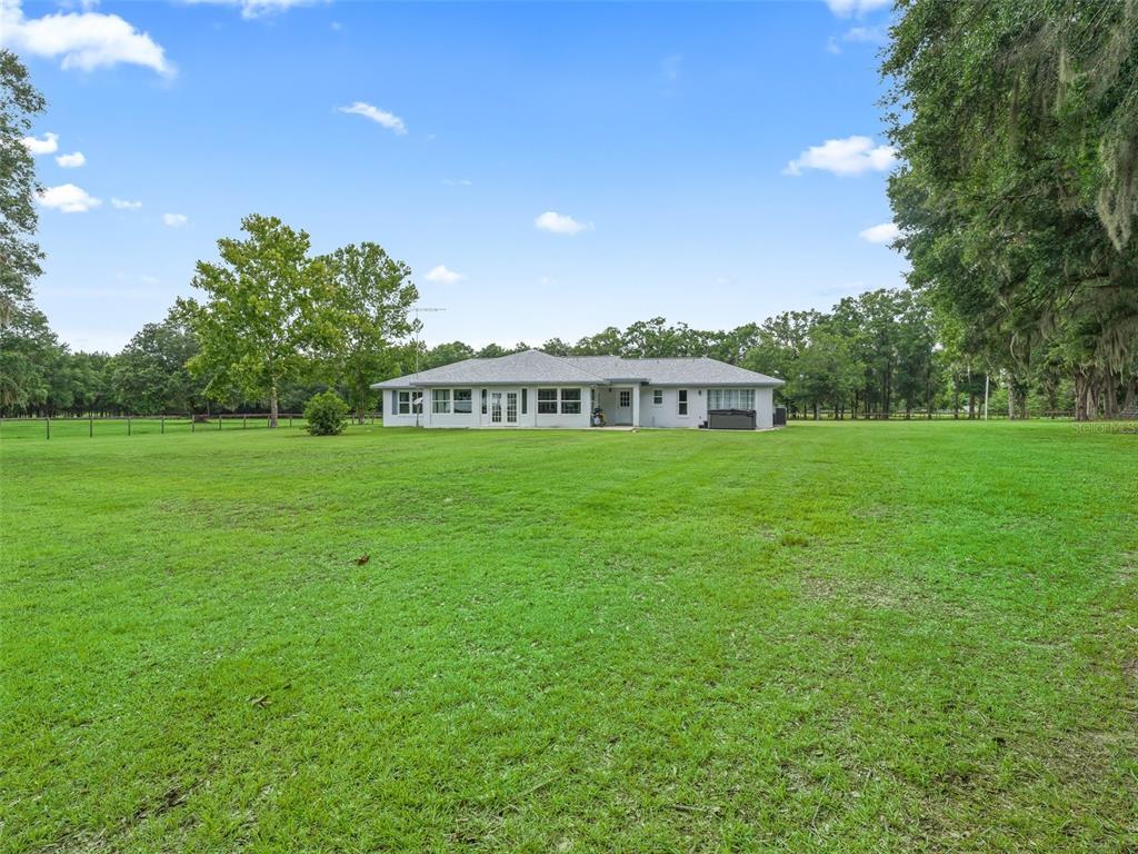 1500 Northwest 155th Street Citra, FL 32113 - Photo 32 of 43 a view of a house with a big yard