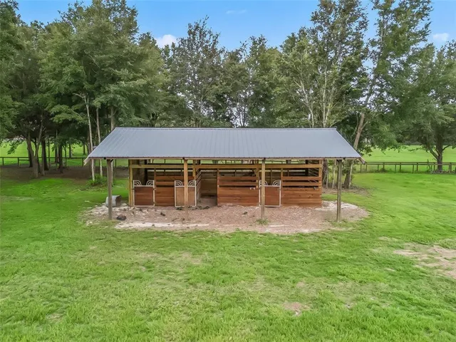 a view of a house with a yard porch and sitting area