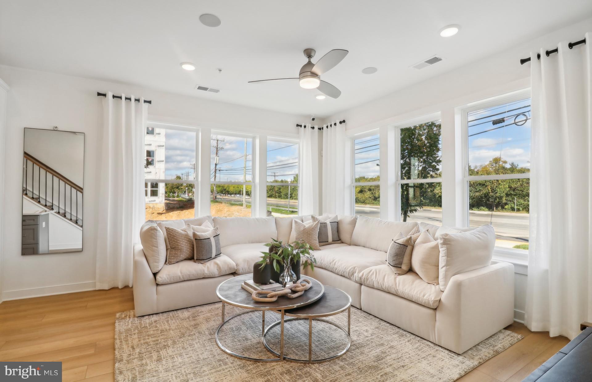 16096 Frederick Road Rockville, MD 20850 - Photo 2 of 35 a living room with furniture and a large window
