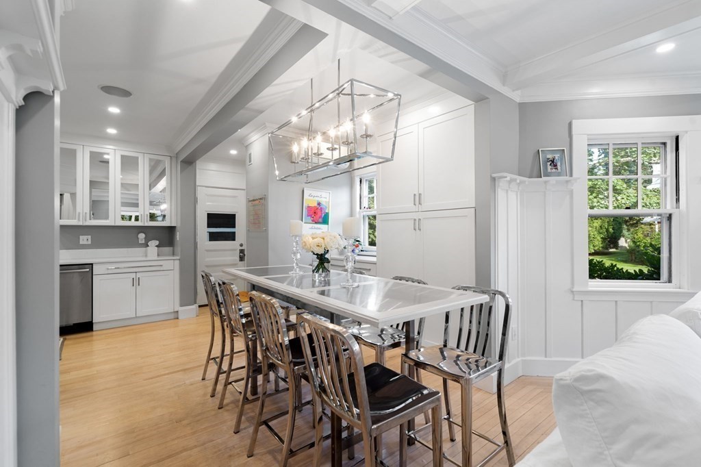 63 Nehoiden Road Newton, MA 02468 - Photo 5 of 22 a kitchen with kitchen island a table and chairs in it
