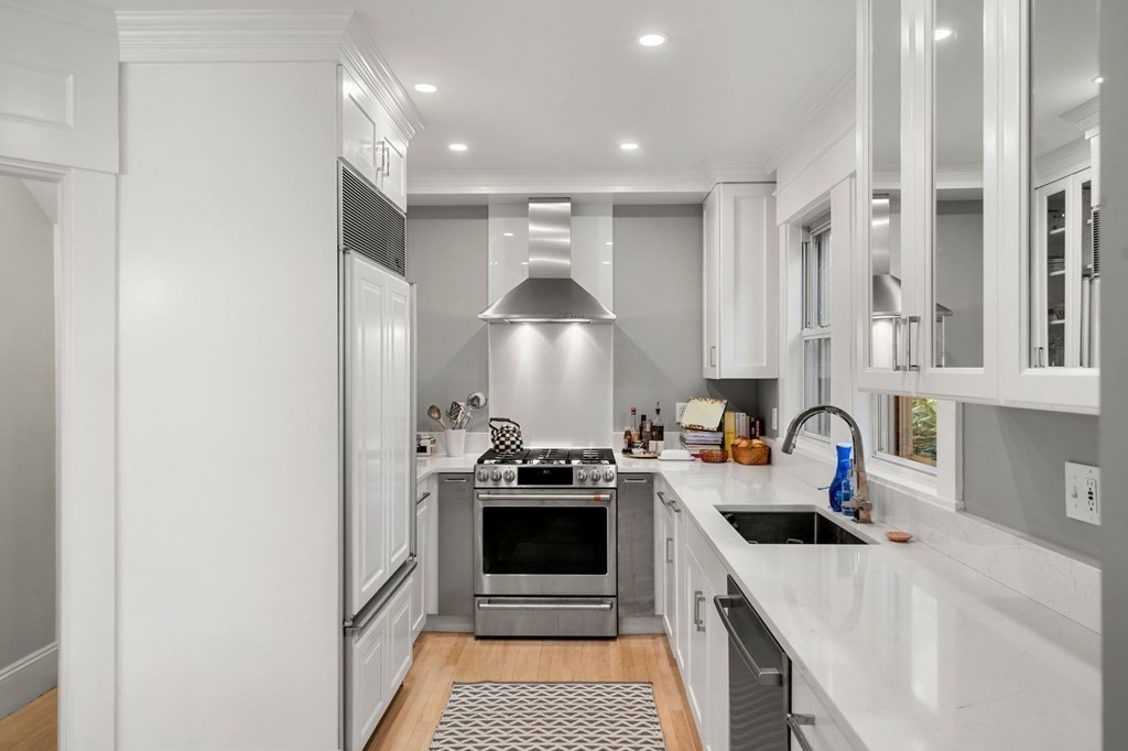 63 Nehoiden Road Newton, MA 02468 - Photo 6 of 22 a kitchen with a stove and a refrigerator