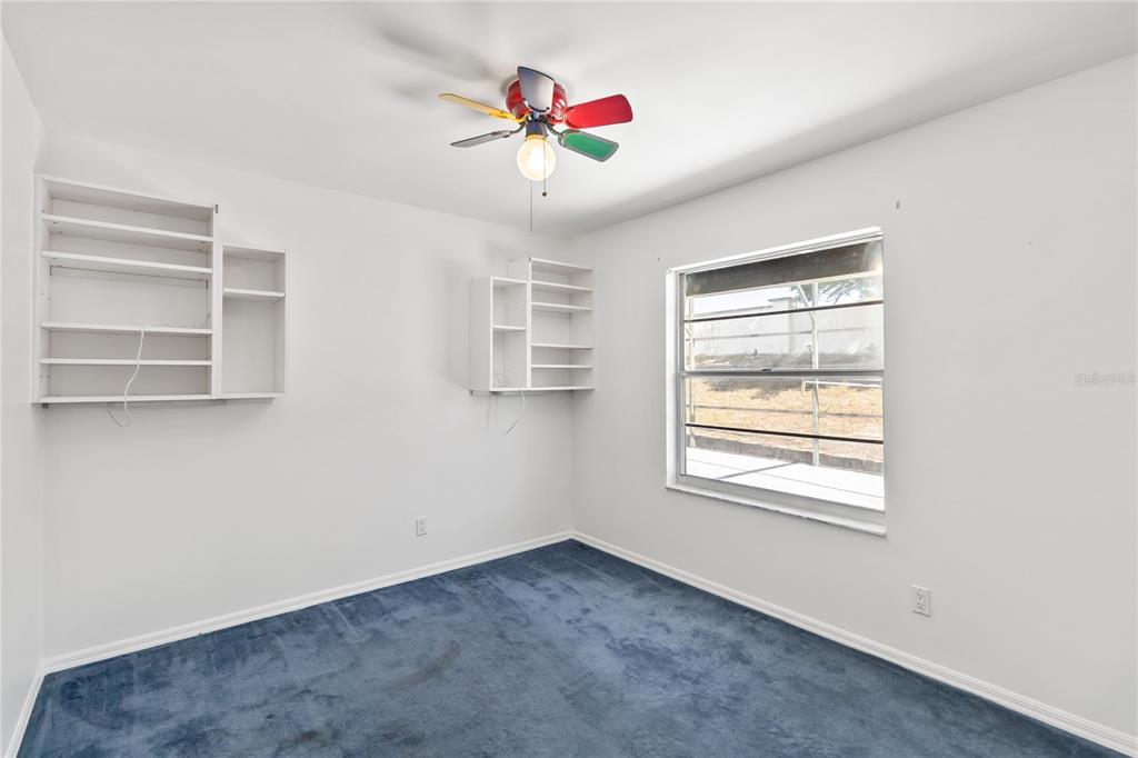 7771 Indian Ridge Trail North Kissimmee, FL 34747 - Photo 24 of 51 a view of an empty room with a window