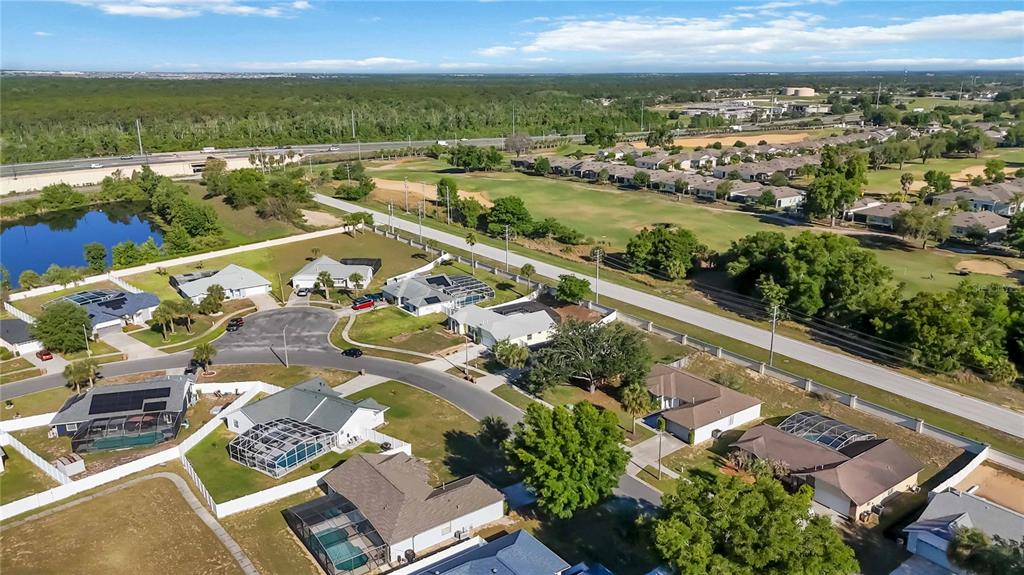 7771 Indian Ridge Trail North Kissimmee, FL 34747 - Photo 47 of 51 an aerial view of residential houses with outdoor space
