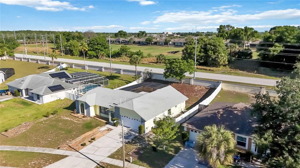 7771 Indian Ridge Trail North Kissimmee, FL 34747 - Photo 50 of 51 an aerial view of a house with swimming pool and ocean view