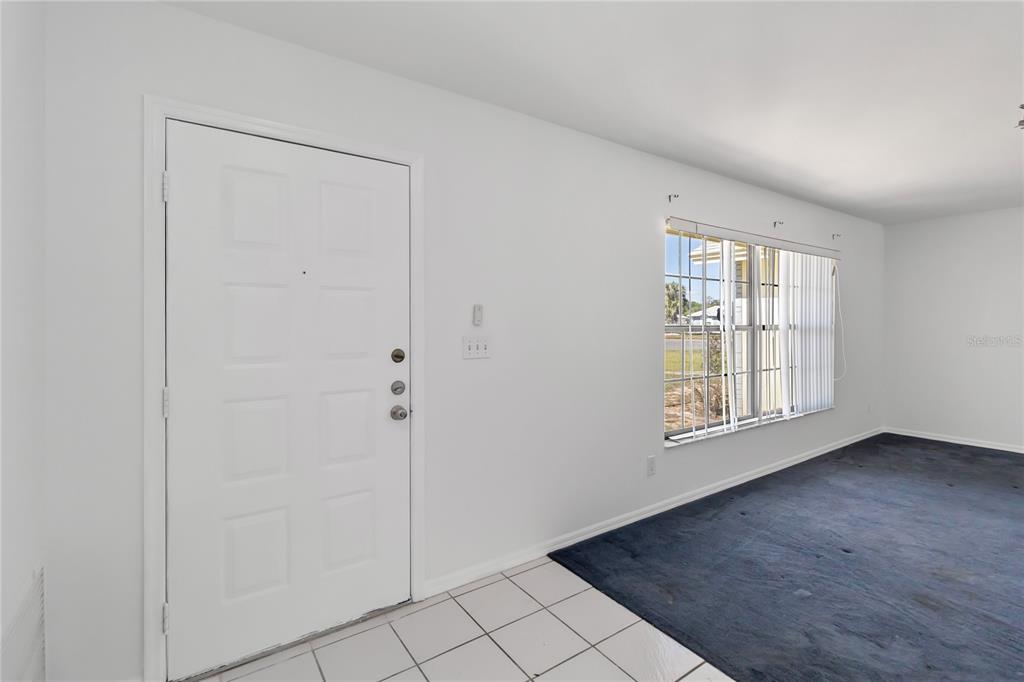 7771 Indian Ridge Trail North Kissimmee, FL 34747 - Photo 6 of 51 an empty room with windows