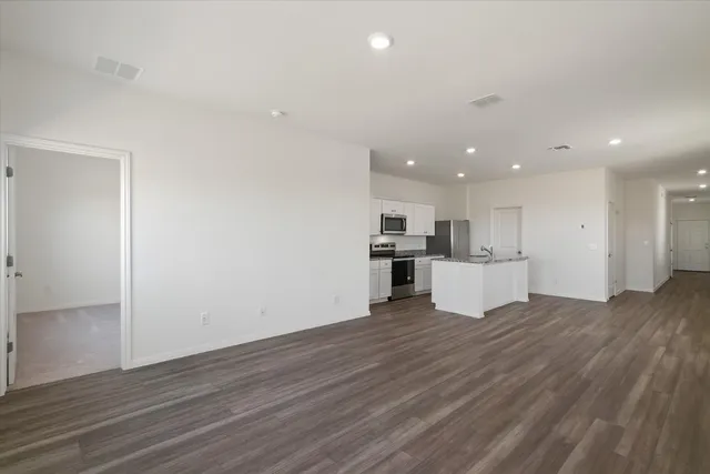 a view of kitchen with wooden floor