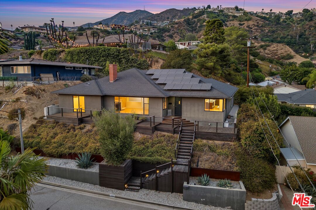a aerial view of a house with a yard