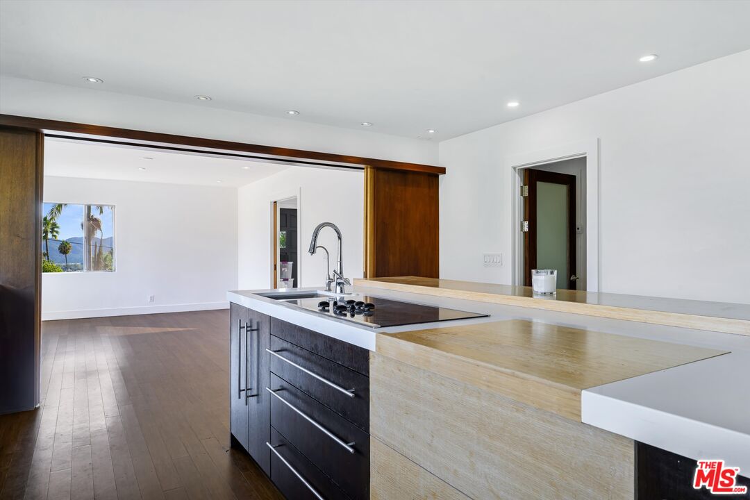 211 Cumberland Road Glendale, CA 91202 - Photo 20 of 48 a kitchen with stainless steel appliances granite countertop a sink stove and cabinets