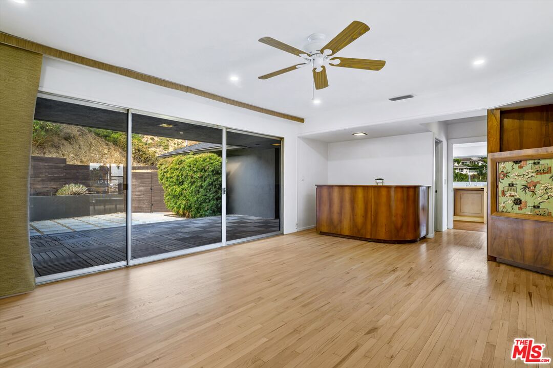 211 Cumberland Road Glendale, CA 91202 - Photo 25 of 48 a view of an empty room with window and wooden floor