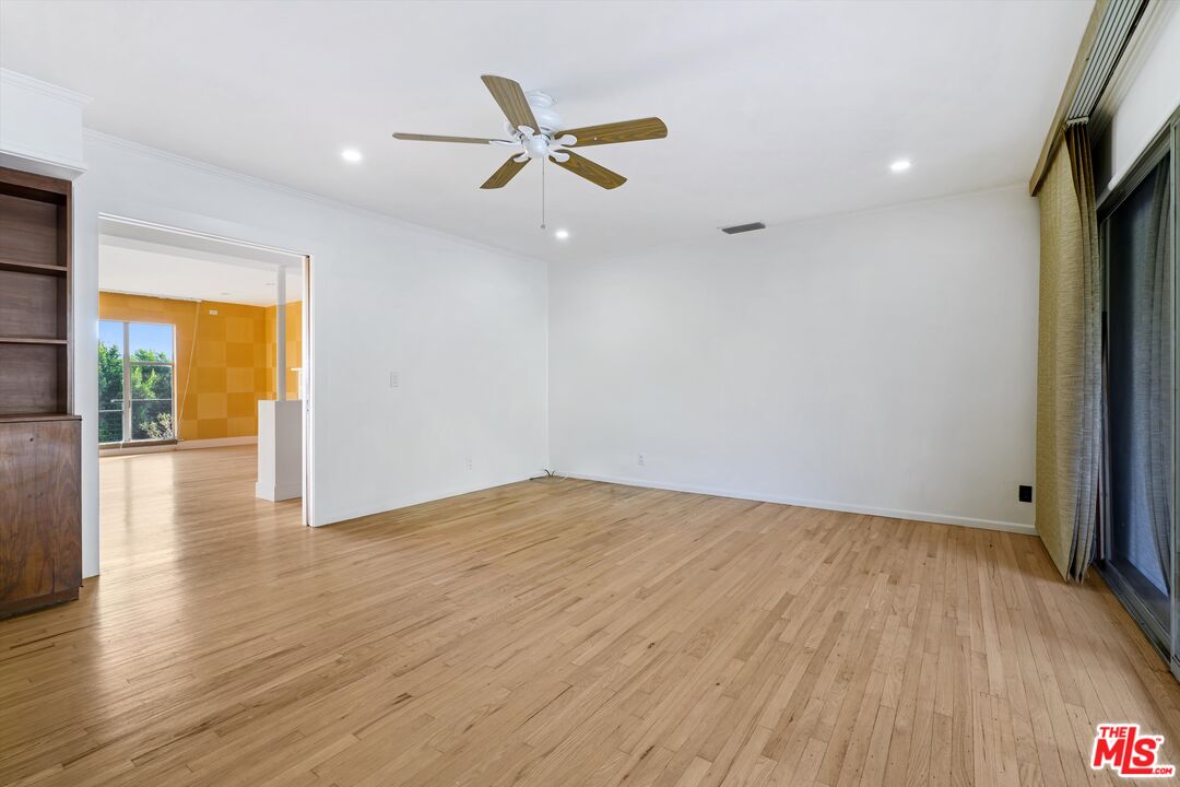 211 Cumberland Road Glendale, CA 91202 - Photo 27 of 48 a view of empty room with wooden floor and fan
