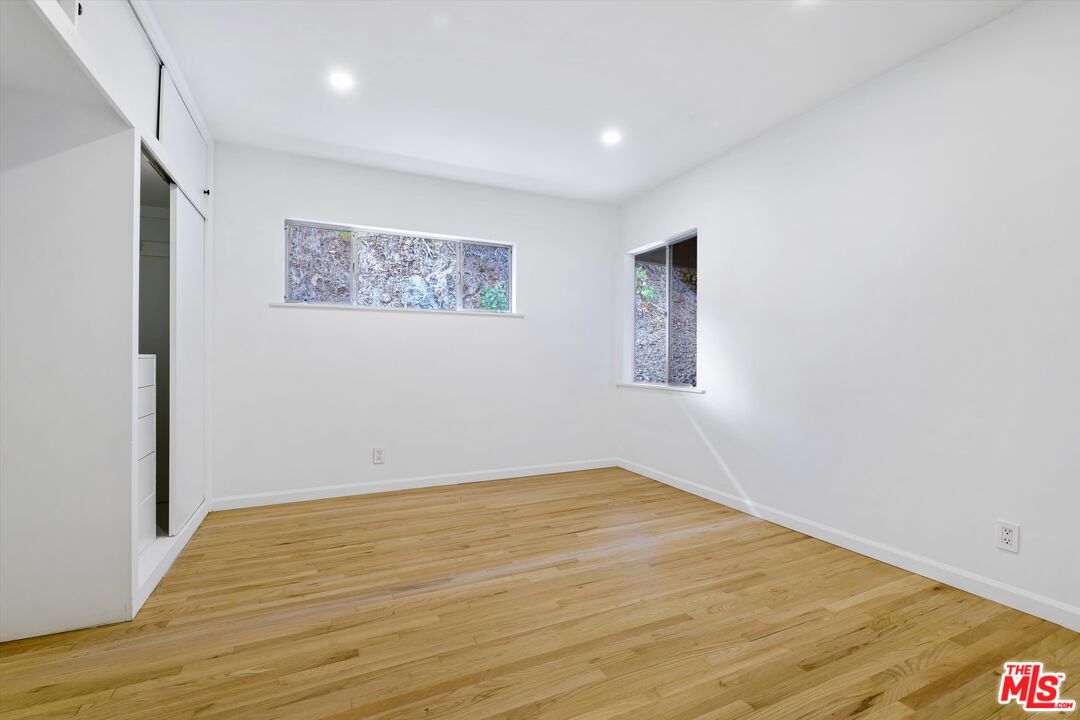211 Cumberland Road Glendale, CA 91202 - Photo 35 of 48 a view of an empty room with wooden floor and a window