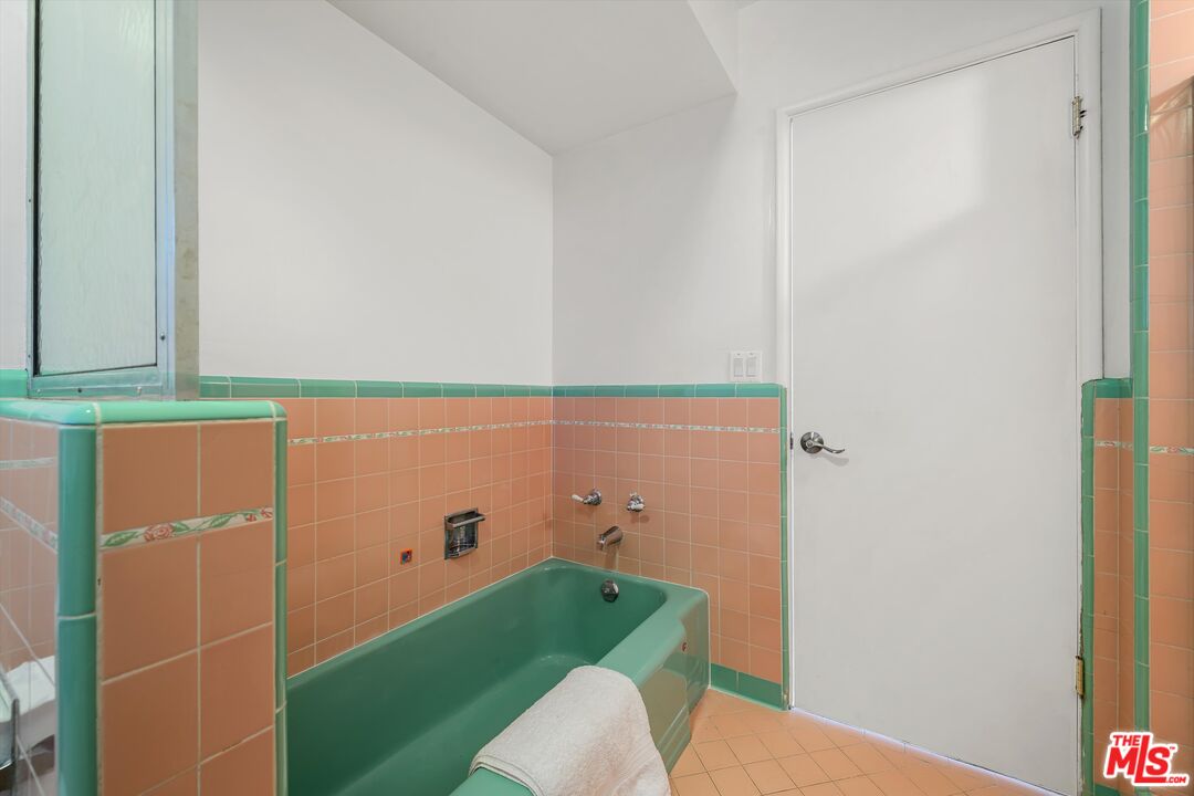 211 Cumberland Road Glendale, CA 91202 - Photo 40 of 48 a bathroom with a sink and a mirror