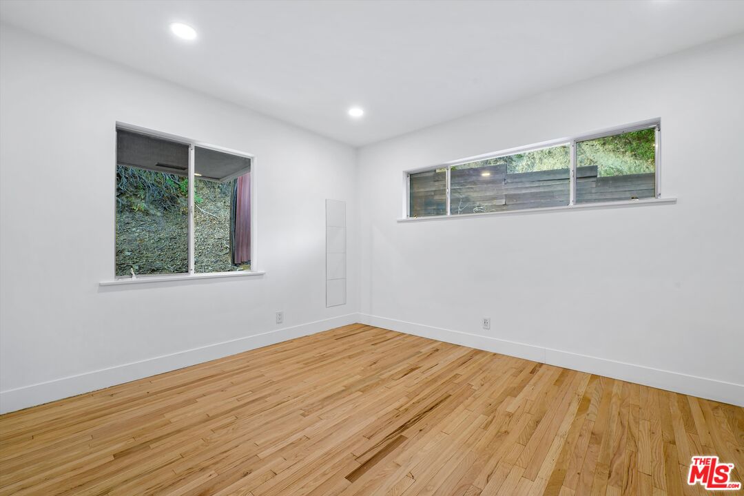 211 Cumberland Road Glendale, CA 91202 - Photo 41 of 48 a view of empty room with wooden floor and fan