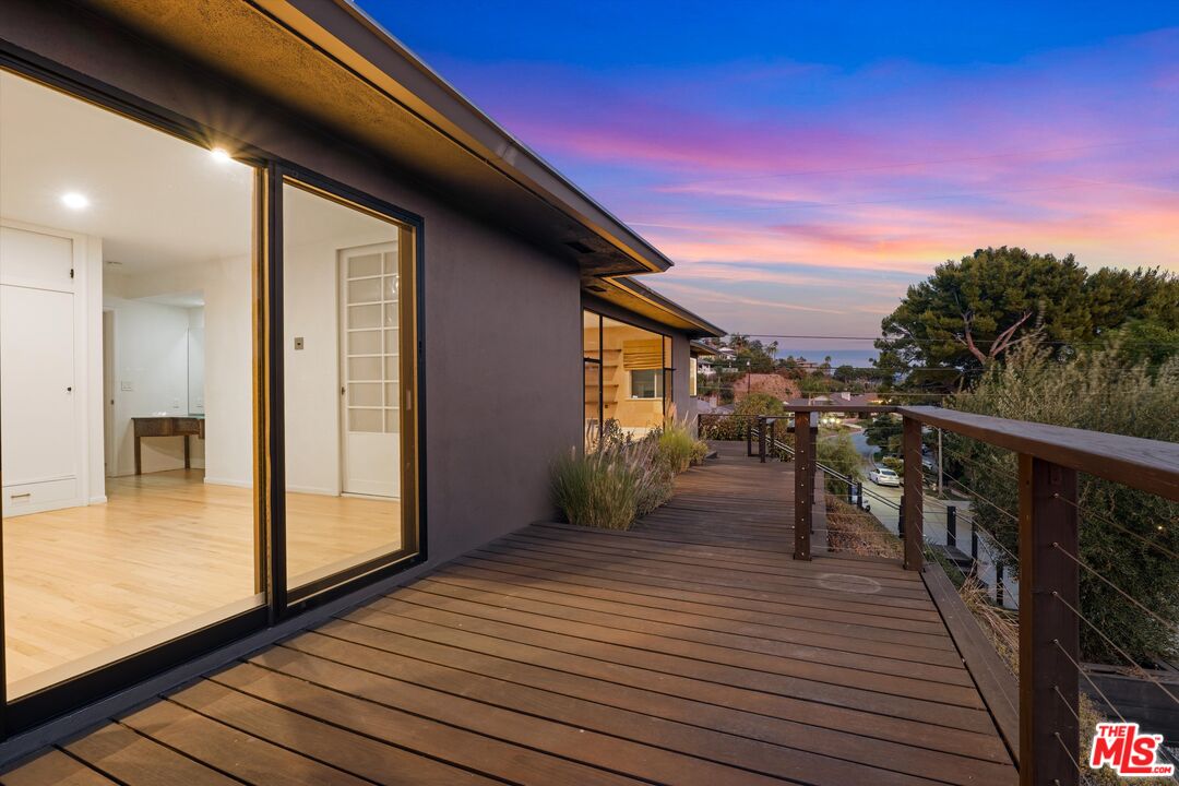 211 Cumberland Road Glendale, CA 91202 - Photo 6 of 48 a view of a balcony with wooden floor and city view