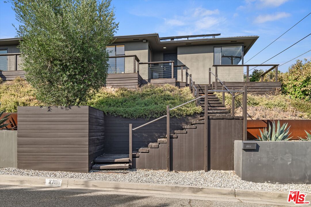 211 Cumberland Road Glendale, CA 91202 - Photo 7 of 48 a front view of a house with garden