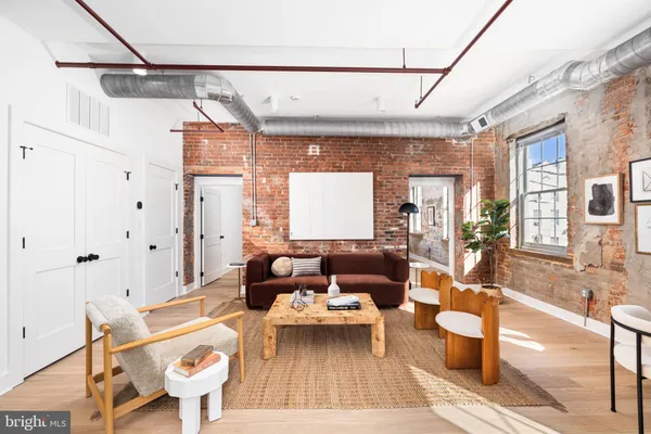 a living room with furniture and a table