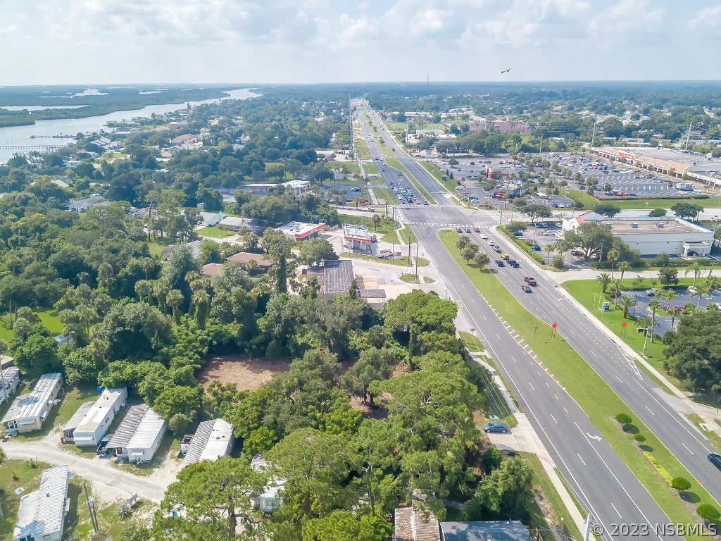 1711 South Ridgewood Avenue Edgewater, FL 32132 - Photo 4 of 9 an aerial view of residential houses with outdoor space