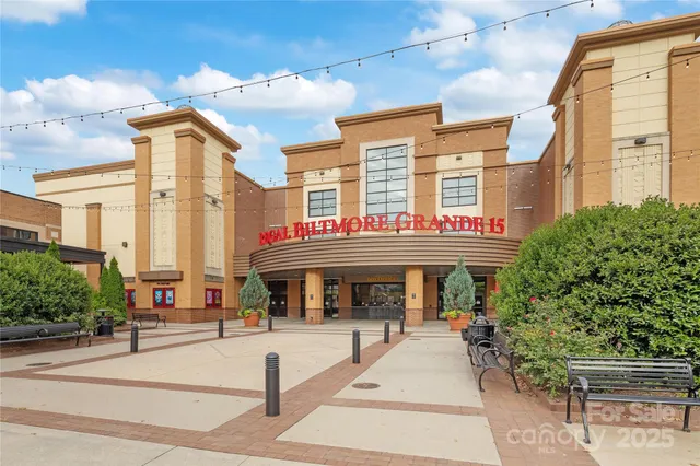 a front view of a building with sitting area