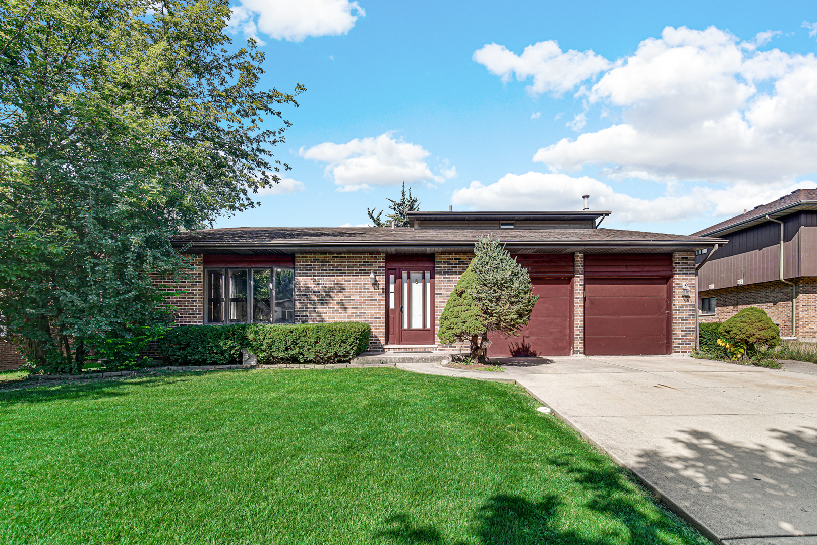 316 Morningside Drive, Unit A Bloomingdale, IL 60108 - Photo 2 of 35 a front view of a house with garden and porch