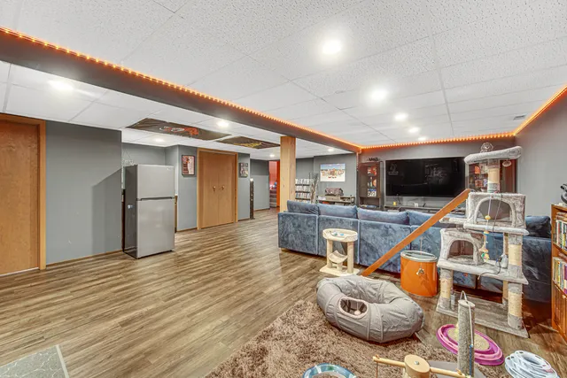 a room with furniture and a flat screen tv