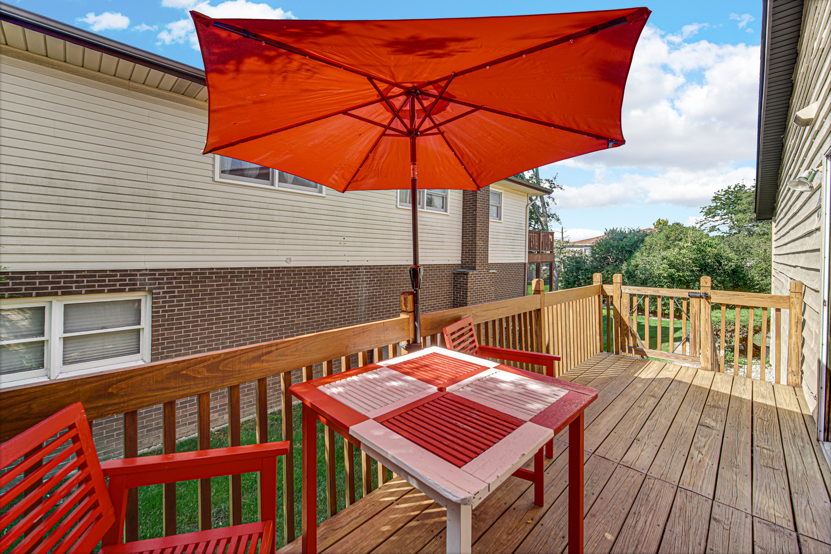 316 Morningside Drive, Unit A Bloomingdale, IL 60108 - Photo 29 of 35 a view of a balcony with wooden floor and outdoor seating