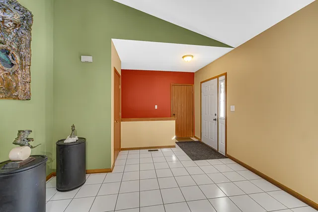 a view of a hallway with wooden shelves
