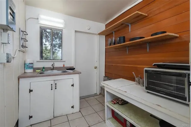 a kitchen with a sink and cabinets