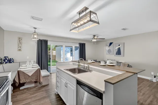 a bedroom with a bed and a ceiling fan