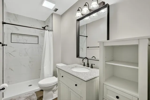 a view of room with wooden floor and workspace