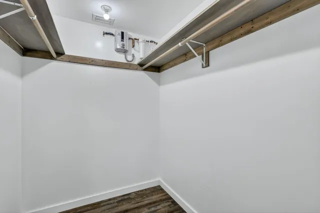 a bathroom with a toilet and shower