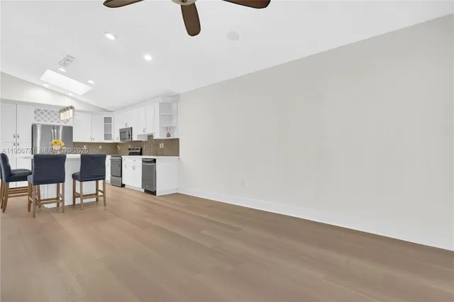 a view of kitchen with furniture and window