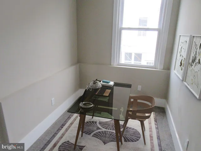 a room with furniture and a window