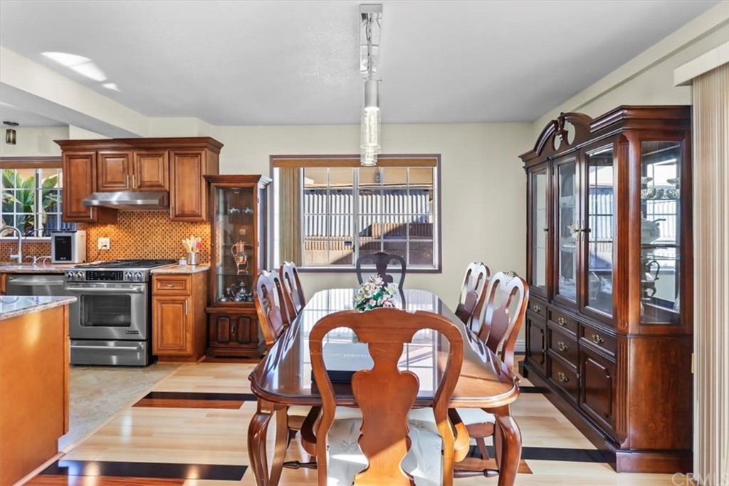 302 East 213th Street Carson, CA 90745 - Photo 12 of 41 a view of a dining room with furniture window and wooden floor