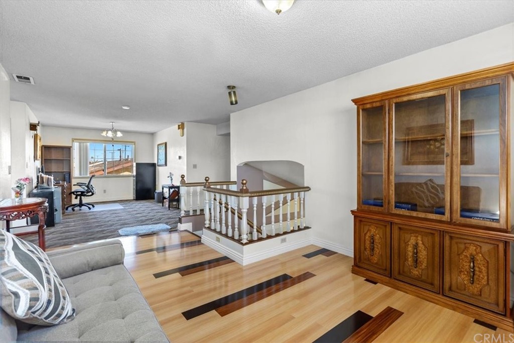 302 East 213th Street Carson, CA 90745 - Photo 18 of 41 a view of a livingroom with furniture and a rug