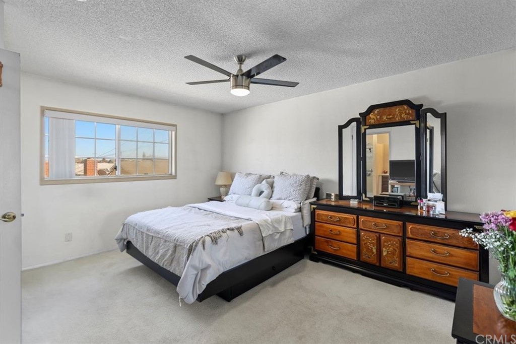 302 East 213th Street Carson, CA 90745 - Photo 19 of 41 a bedroom with a bed dresser and window