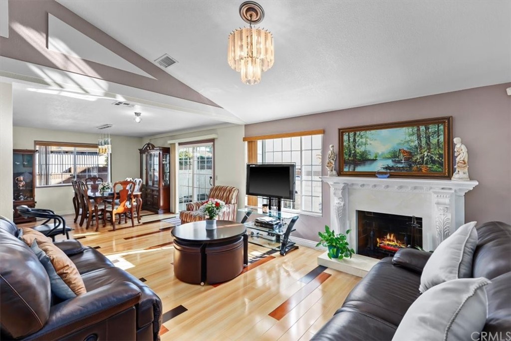 302 East 213th Street Carson, CA 90745 - Photo 2 of 41 a living room with furniture fireplace and a large window