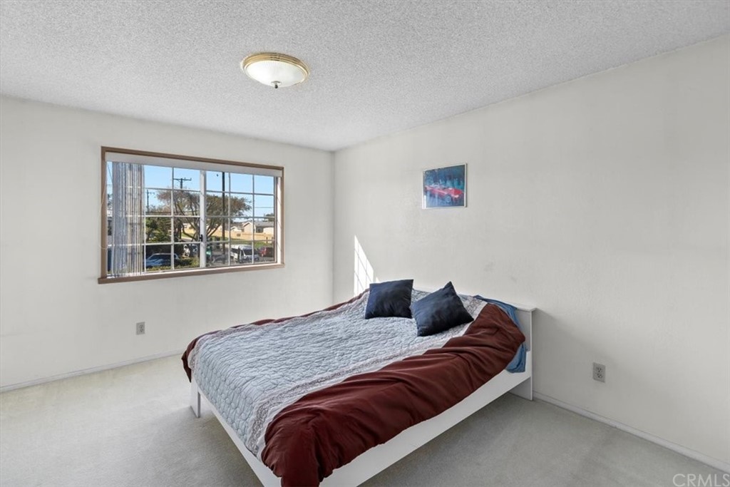 302 East 213th Street Carson, CA 90745 - Photo 24 of 41 a bedroom with a bed and a window