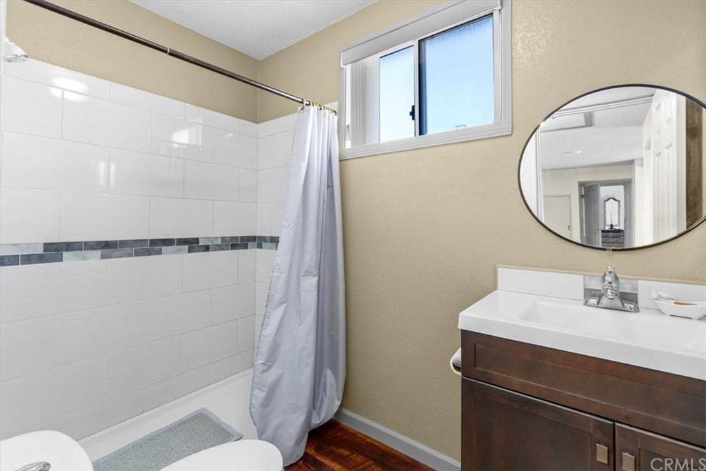 302 East 213th Street Carson, CA 90745 - Photo 26 of 41 a bathroom with a sink mirror vanity and toilet