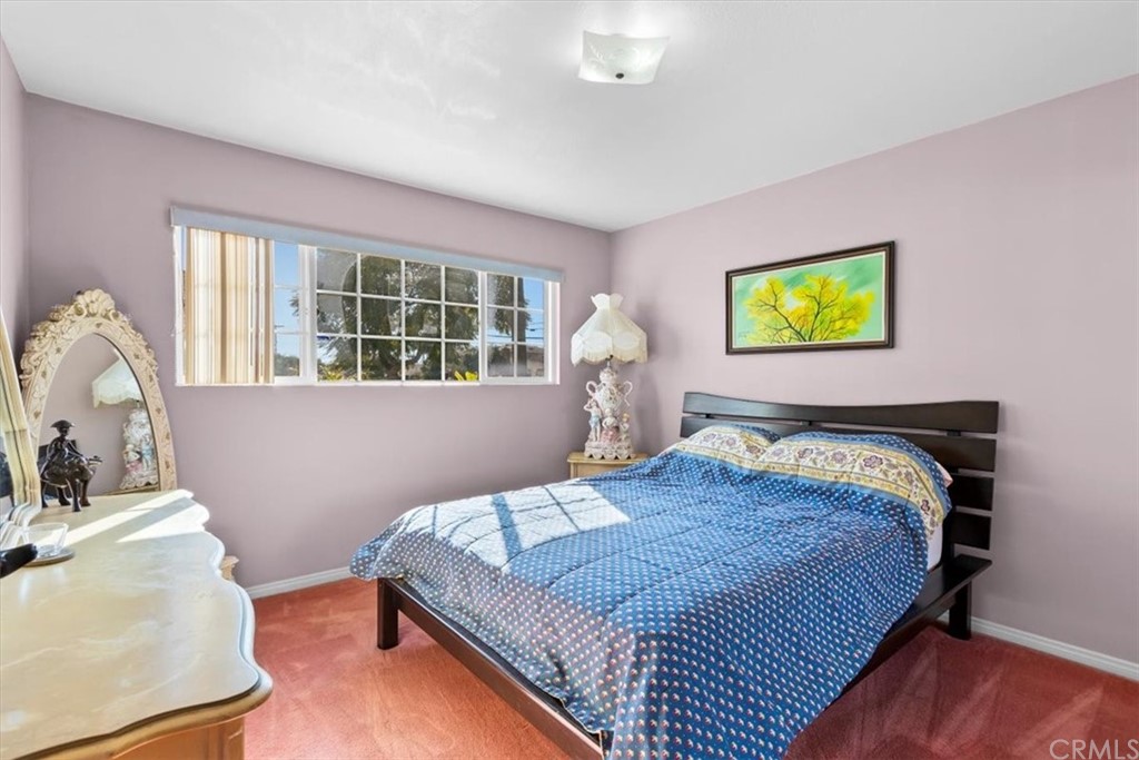 302 East 213th Street Carson, CA 90745 - Photo 28 of 41 a bedroom with a bed and a dresser