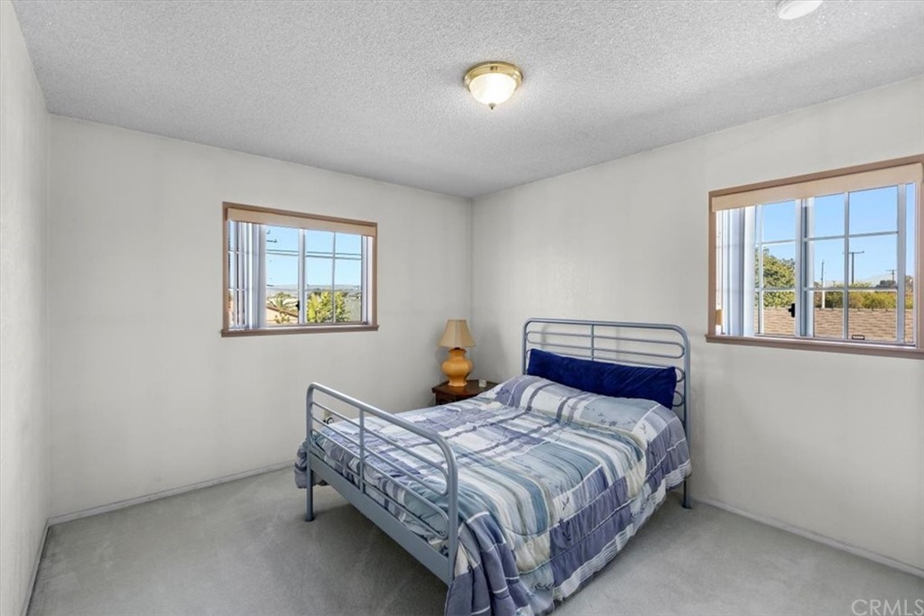 302 East 213th Street Carson, CA 90745 - Photo 31 of 41 a bedroom with a bed and a window