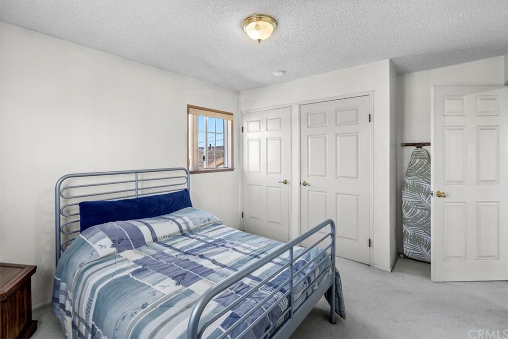302 East 213th Street Carson, CA 90745 - Photo 32 of 41 a bedroom with a bed and a window