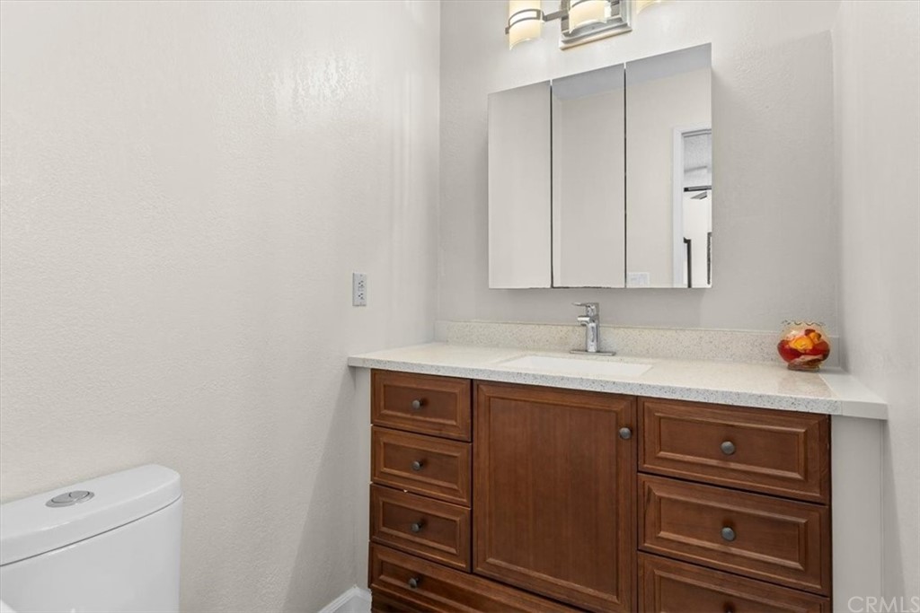 302 East 213th Street Carson, CA 90745 - Photo 37 of 41 a bathroom with a sink and a mirror